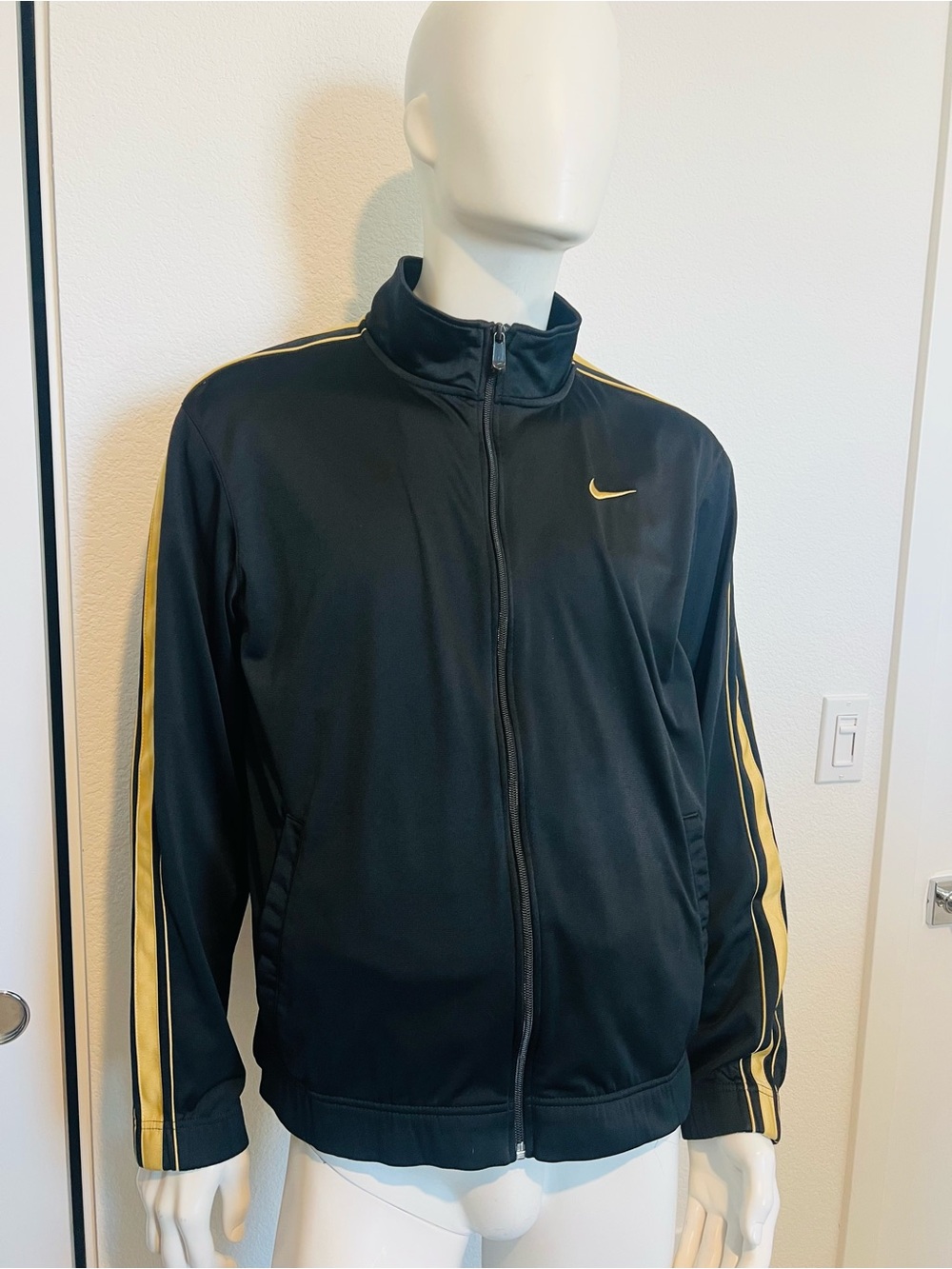 Nike Black Track Jacket with Gold Stripe Accents